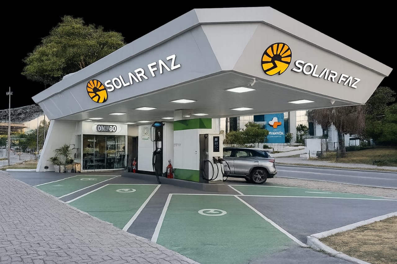 Posto de recarga com cobertura e vagas demarcadas em verde para veículos elétricos